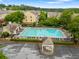 Community pool with lounge chairs, tables and parking area at 4879 Seldon Se Way, Smyrna, GA 30080