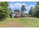 The home's backyard has a deck and a lush manicured lawn at 5406 Jamestowne Dr, Powder Springs, GA 30127
