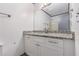 Updated bathroom with granite countertop, sleek vanity and modern fixtures at 5406 Jamestowne Dr, Powder Springs, GA 30127
