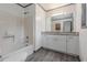 This bathroom has white cabinetry and granite countertops at 5406 Jamestowne Dr, Powder Springs, GA 30127
