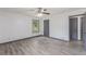 This bedroom features neutral colors, grey vinyl floors, and a ceiling fan at 5406 Jamestowne Dr, Powder Springs, GA 30127