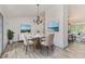 Well-lit dining room with contemporary chandelier and decor at 5406 Jamestowne Dr, Powder Springs, GA 30127