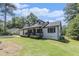 A charming two-story home with a landscaped yard at 5406 Jamestowne Dr, Powder Springs, GA 30127