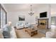 Inviting living room with a fireplace, comfortable seating, and abundant natural light at 5406 Jamestowne Dr, Powder Springs, GA 30127