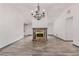 Open-concept living room features a stone fireplace, wood floors and vaulted ceiling at 5406 Jamestowne Dr, Powder Springs, GA 30127