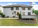 This home features a large backyard with a well-maintained lawn, deck, and mature trees at 8032 Ridge Vly, Woodstock, GA 30189