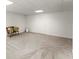 This finished basement area with carpet and recessed lighting provides additional living space, with neutral decor at 8032 Ridge Vly, Woodstock, GA 30189