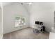 Bright bedroom features carpet floors, vaulted ceiling, a window, and workspace at 8032 Ridge Vly, Woodstock, GA 30189