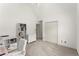 Bright bedroom featuring carpet floors, vaulted ceiling, white walls, and a closet at 8032 Ridge Vly, Woodstock, GA 30189