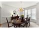 Elegant dining room with hardwood floors, chandelier, and seating for six at 8032 Ridge Vly, Woodstock, GA 30189