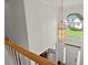 This foyer has hardwood floors, a chandelier, and a view of the front lawn from the arched window at 8032 Ridge Vly, Woodstock, GA 30189