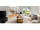 Inviting living room with large windows, comfortable seating, and open floor plan at 8032 Ridge Vly, Woodstock, GA 30189