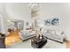Bright living room featuring high ceilings, hardwood floors, and an open floor plan at 8032 Ridge Vly, Woodstock, GA 30189