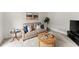 Cozy living room with neutral tones, plush seating, and stylish decor at 8032 Ridge Vly, Woodstock, GA 30189