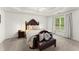 Comfortable main bedroom with a ceiling fan, plush bedding, and soft lighting at 8032 Ridge Vly, Woodstock, GA 30189