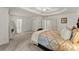 Large main bedroom with closet space, neutral carpet, and a doorway to bathroom at 8032 Ridge Vly, Woodstock, GA 30189