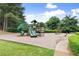 Community playground area with mature trees, slides, and swings for residents to enjoy at 8032 Ridge Vly, Woodstock, GA 30189