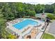 Resort style pool featuring lap lanes, kiddie area, covered seating, and ample lounge chairs for relaxing at 8032 Ridge Vly, Woodstock, GA 30189