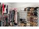 Organized walk-in closet features ample shelving and hanging space for clothes, shoes, and accessories at 8032 Ridge Vly, Woodstock, GA 30189