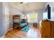 Cozy bedroom with hardwood floors, vaulted ceiling, and wood bunkbeds at 1059 Verbena Way, Auburn, GA 30011