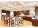 Spacious kitchen with custom cabinets, stainless steel appliances, and a large island at 1059 Verbena Way, Auburn, GA 30011