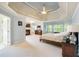 Expansive main bedroom featuring a fireplace, sitting area, and large windows with natural light at 1059 Verbena Way, Auburn, GA 30011