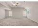 Large primary bedroom with vaulted ceiling, carpet, and several bright windows at 1243 Riverstone Rd, Jonesboro, GA 30238
