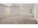 Spacious bedroom with multiple windows offering natural light and neutral carpet at 1243 Riverstone Rd, Jonesboro, GA 30238