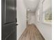 Bright entryway with hardwood floors and natural light streaming through the window at 1243 Riverstone Rd, Jonesboro, GA 30238