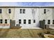 A view of the backyard patio with a view of the home's windows and siding at 4527 Moray Dr, Mableton, GA 30126