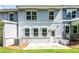Backyard featuring a cozy patio, lush green lawn, and well-maintained landscaping at 4527 Moray Dr, Mableton, GA 30126