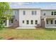 A townhome featuring a cozy backyard with a concrete patio and a small fenced area at 4527 Moray Dr, Mableton, GA 30126