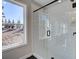 Modern bathroom with white subway tile shower and a window for natural light at 4527 Moray Dr, Mableton, GA 30126