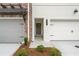 Inviting entryway showcasing a charming front door and manicured landscaping at 4527 Moray Dr, Mableton, GA 30126