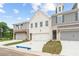 Charming townhouse exterior featuring a blend of brick and siding accents at 4527 Moray Dr, Mableton, GA 30126