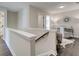 Upstairs hallway with hardwood floors, a staircase, and a view into a bedroom and an office at 4527 Moray Dr, Mableton, GA 30126