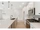A modern kitchen with stainless steel appliances, a large island, and pendant lighting at 4527 Moray Dr, Mableton, GA 30126