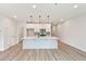 Modern kitchen boasts an island, pendant lighting and stainless steel appliances at 4527 Moray Dr, Mableton, GA 30126