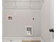 Bright, well-lit laundry room equipped with all the necessary connections and hardware at 4527 Moray Dr, Mableton, GA 30126