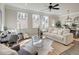 Open-concept living room with neutral tones, hardwood flooring, lots of natural light, and modern decor at 4527 Moray Dr, Mableton, GA 30126
