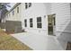 A view of the backyard patio with a view of the kitchen through an open back door at 4527 Moray Dr, Mableton, GA 30126