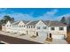Street view showcasing townhomes with well-manicured lawns and attached garages at 4527 Moray Dr, Mableton, GA 30126