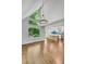 Light-filled dining area with modern chandelier, hardwood floors, and open to the kitchen at 615 Nw Mark Trail Nw Ct, Atlanta, GA 30328