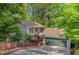 Charming home with a two car garage, wooden fence and ample yard space at 615 Nw Mark Trail Nw Ct, Atlanta, GA 30328