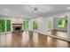 Spacious living room with fireplace, hardwood floors, and sliding glass doors to the deck at 615 Nw Mark Trail Nw Ct, Atlanta, GA 30328