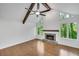Bright living room boasts high ceilings, exposed beams, and a modern fireplace at 615 Nw Mark Trail Nw Ct, Atlanta, GA 30328