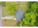 An aerial view showcasing the house's roof, driveway, and surrounding lush greenery at 2078 Olive Springs Se Rd, Marietta, GA 30060