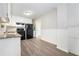 Updated kitchen with granite counters, white cabinets, and black appliances offers a stylish and functional space at 2078 Olive Springs Se Rd, Marietta, GA 30060