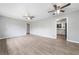 Spacious living room with new floors, ceiling fans, and an open layout perfect for entertaining and relaxation at 2078 Olive Springs Se Rd, Marietta, GA 30060