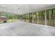 Large screened porch offering views of backyard trees at 2078 Olive Springs Se Rd, Marietta, GA 30060